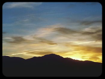 Scenic view of mountains at sunset