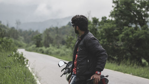 Man riding bicycle on road