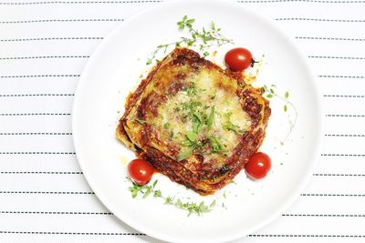 Directly above shot of lasagna served on table