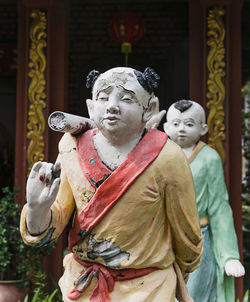 Buddha statue against building