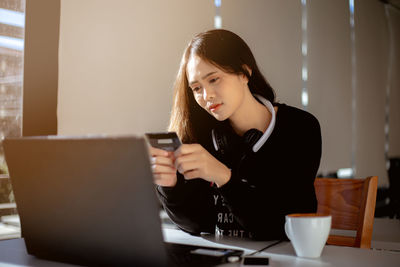 Young woman using mobile phone