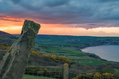 Scenic view of sea against dramatic sky