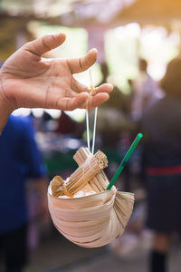 Close-up of hand holding ice cream