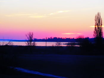 Scenic view of silhouette trees against sky during sunset