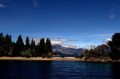 Scenic view of lake against blue sky