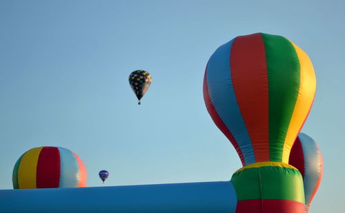 Low angle view of hot air balloons against sky