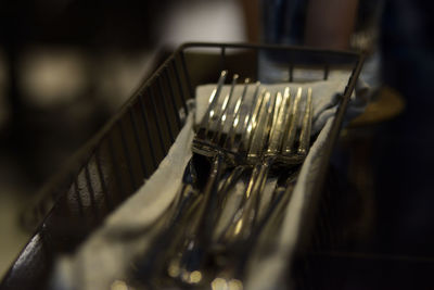 Close-up of forks on container