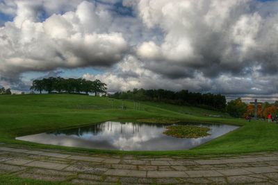 Scenic view of landscape against cloudy sky