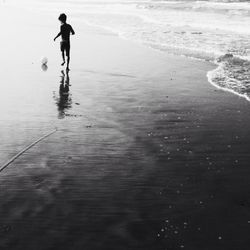 Woman standing on beach