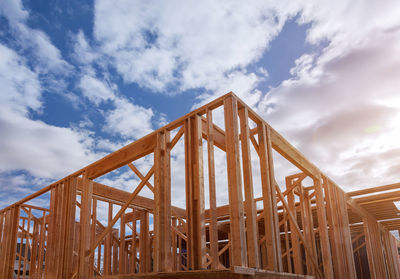 Low angle view of construction site against sky