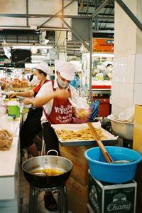 People at market stall