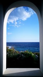 Scenic view of sea against blue sky