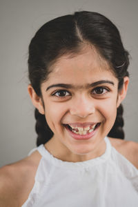 Close-up portrait of a smiling young woman