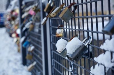 Close-up of love locks on railing