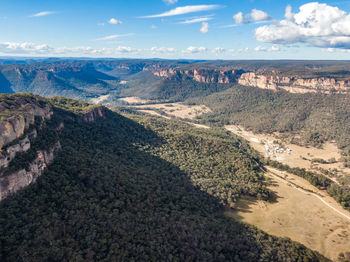 High angle view of land against cloudy sky