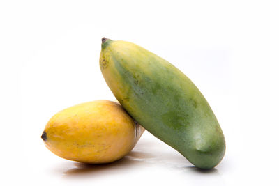 Close-up of fruit against white background