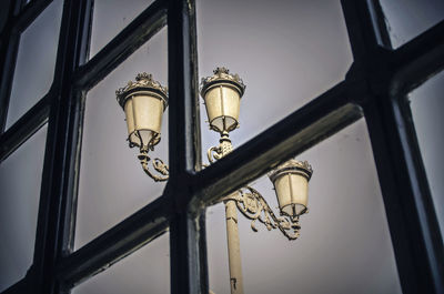 Streetlight through the window of a restaurant in seville, andalusia, spain