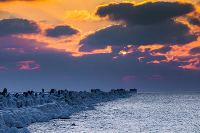 Scenic view of sea against sky at sunset