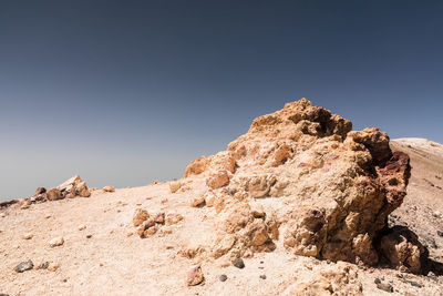 Low angle view of rock formation against clear sky