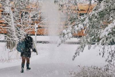 My daughter running through the snow to the school bus