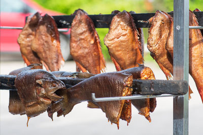 Various dry smoked spiced salmon or trout fish ready to eat in a fish market