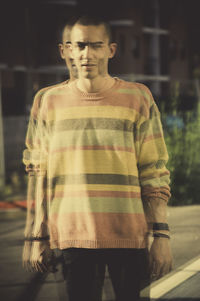 Portrait of young man standing outdoors