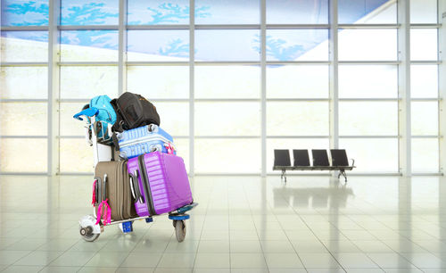 Luggage cart on floor at airport