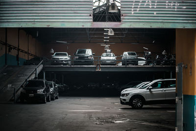 Cars parked on road in city