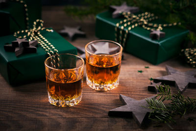 Whiskey, brandy or liquor shot and christmas decorations