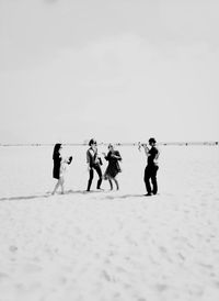 Friends standing on white background