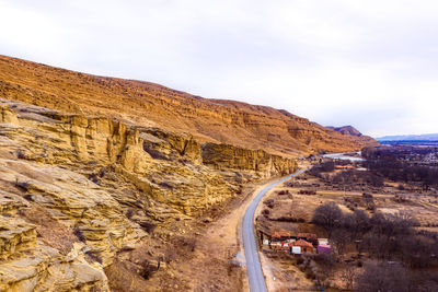 Scenic view of mountain road against sky