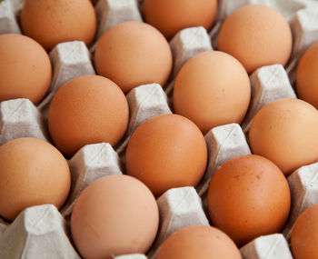 Full frame shot of eggs in crate at market for sale