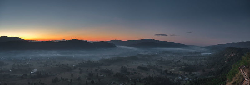 Panoramic view of townscape against sky during sunset