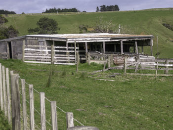 Built structure on field against sky