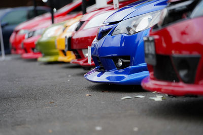 Close-up of car on road