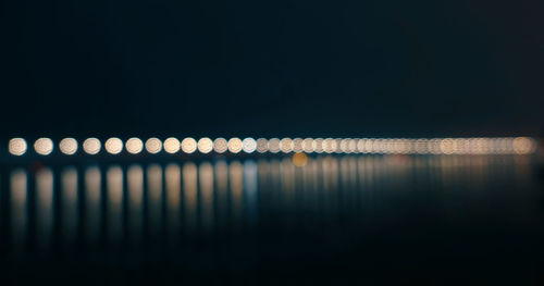 Defocused image of illuminated lights at night