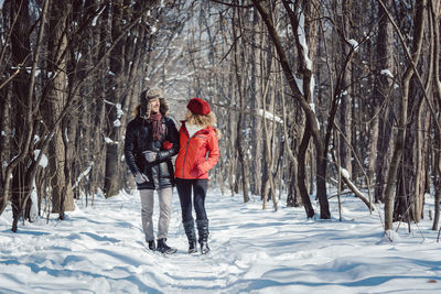 People on snow covered land