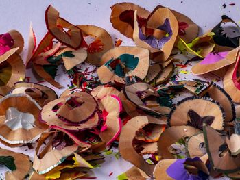 High angle view of colorful pencil shavings on table