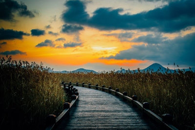 Scenic view of field against sky during sunset