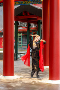 Rear view of woman standing in city