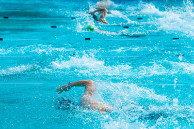 Man swimming in pool