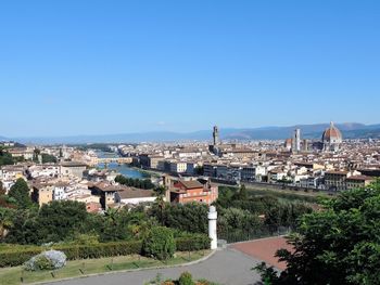 High angle view of townscape against clear blue sky