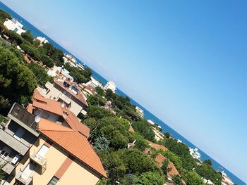 View of sea against clear blue sky