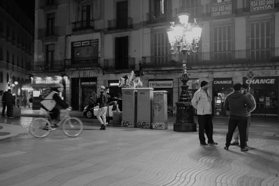 People on city street at night