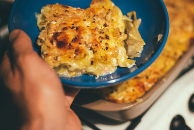 Close-up of person holding food