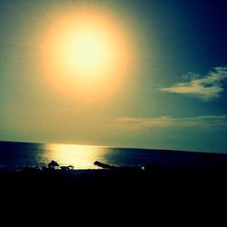 Scenic view of sea at sunset