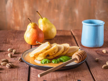 Close-up of fruits in plate on table