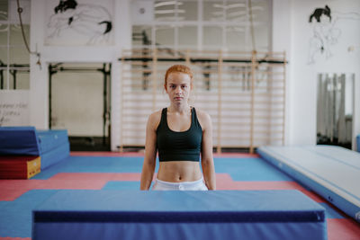 Portrait of confident woman in gym