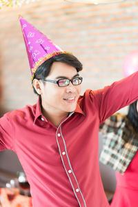 Close-up of man enjoying during christmas party