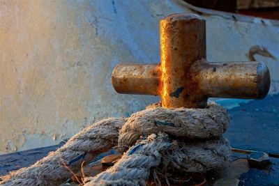 Close-up of rope on rusty boat